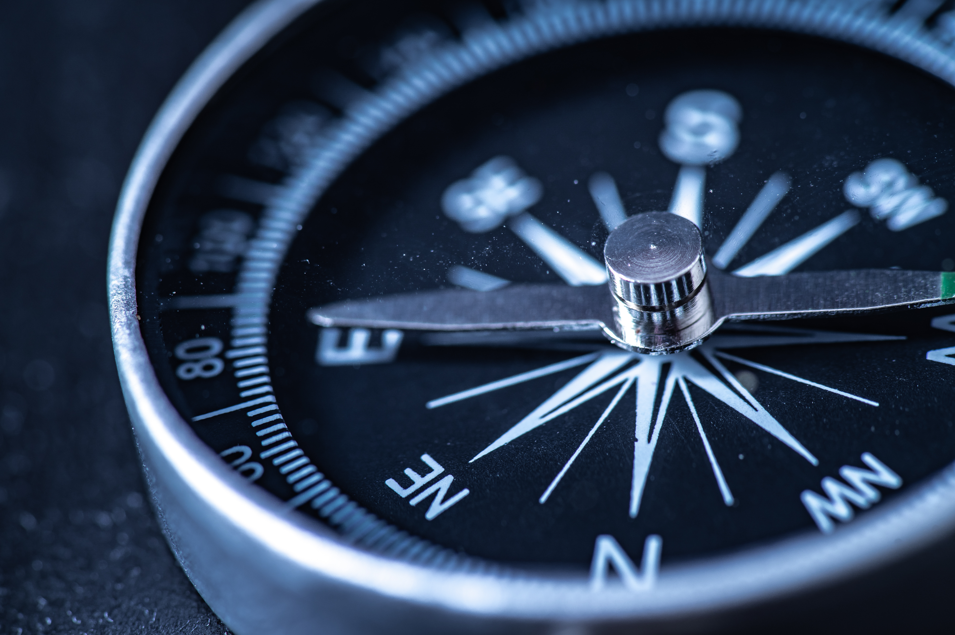 Travel-planning-navigation-concept.-Classic-magnetic-detail-of--black-compass-on-light-blue-backround-1313965923_4000x2661.jpeg